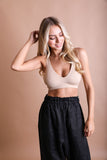 Stretchy lace seamless beige bralette ideal for layering and everyday comfort.