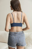 Versatile blue lace brami top with waistband loop detail for styling.